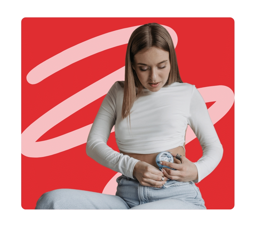 Young woman managing blood sugar levels by applying CGM monitor