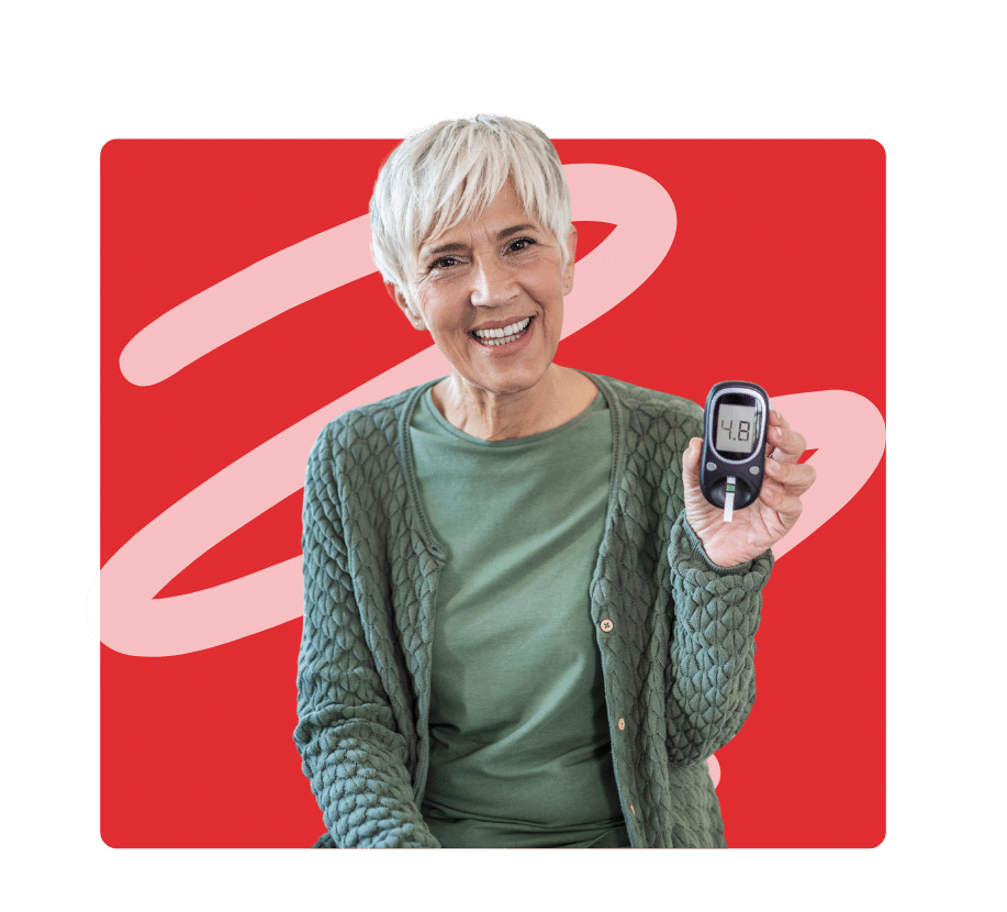 Smiling woman showing a glucose monitor during Diabetes Awareness Month