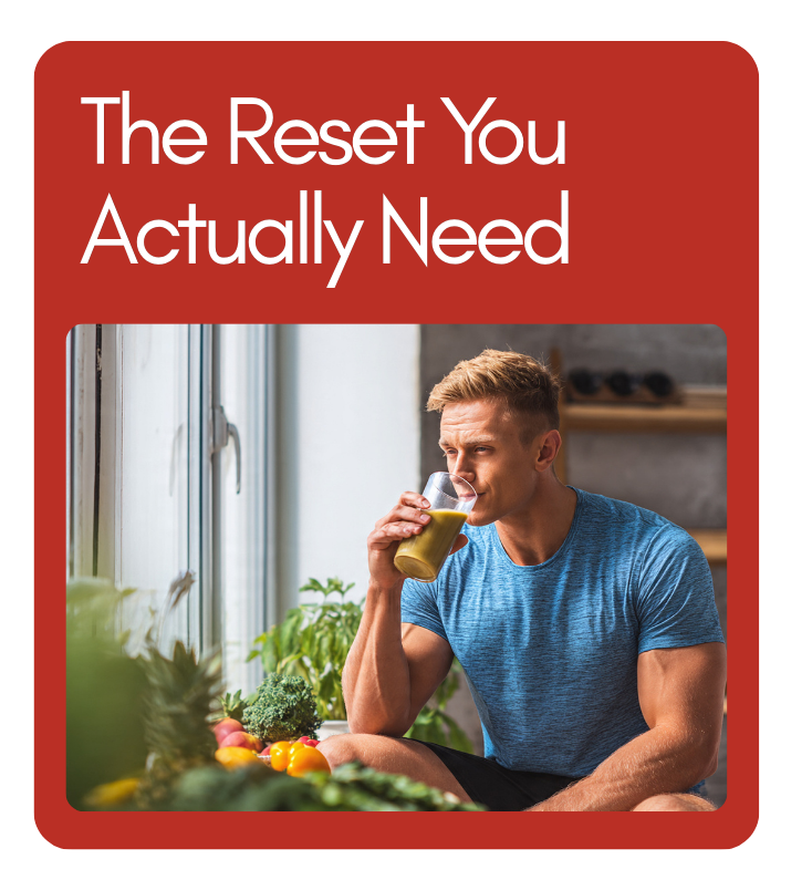 Reset with Fiber - Revivify For Life man drinking a green smoothie in a kitchen filled with fresh fiber foods