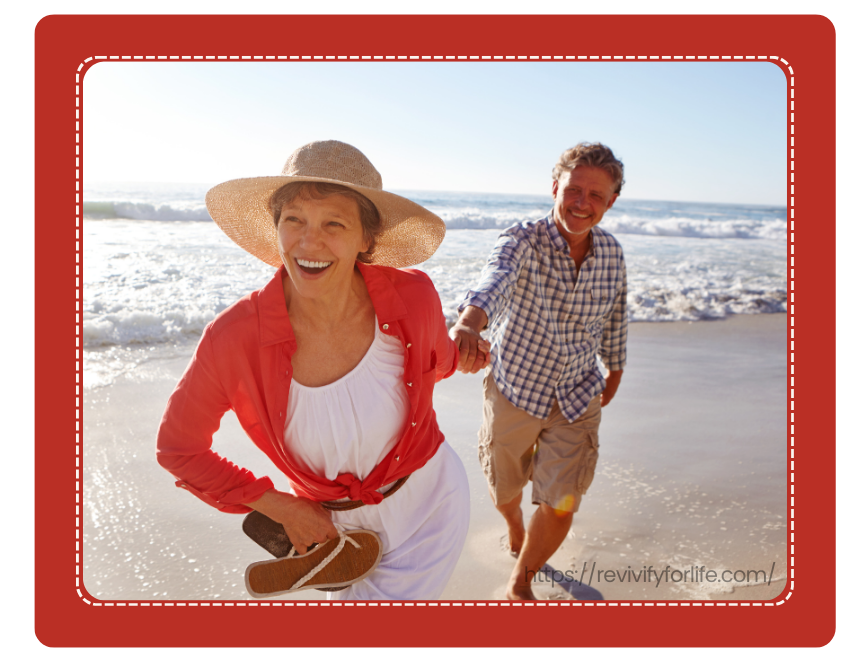 Longevity Lifestyle Supported by Cellular Wellness - Revivify For Life Active couple walking on beach representing longevity and cellular wellness
