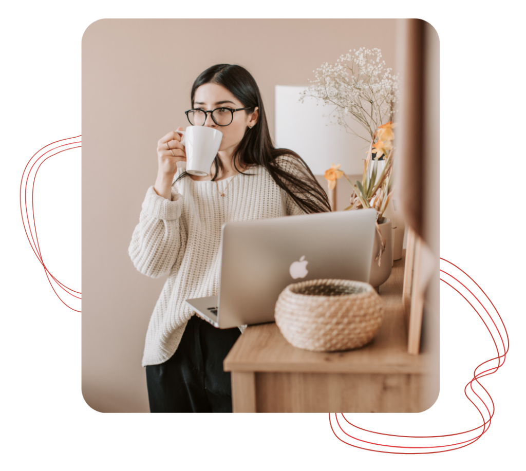 img10 - Revivify For Life Health and wellness routine image showing a woman drinking tea while working on a laptop